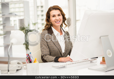 To use this stock image in your creative project, please select the size you need over to the right and click the "Add to Cart" button.
Your downloaded image will come with the Cutcaster watermark removed so don’t worry about the watermark you see on this page. Smiling casual businesswoman working with computer stock photo, Portrait of smiling casual businesswoman working with computer in the office by Wavebreak Media
