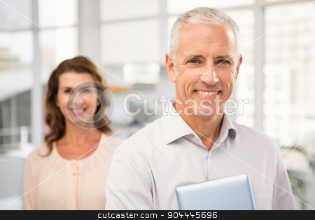To use this stock image in your creative project, please select the size you need over to the right and click the "Add to Cart" button.
Your downloaded image will come with the Cutcaster watermark removed so don’t worry about the watermark you see on this page. Casual business colleagues smiling at camera stock photo, Portrait of casual business colleagues smiling at camera in the office by Wavebreak Media