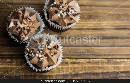 To use this stock image in your creative project, please select the size you need over to the right and click the "Add to Cart" button.
Your downloaded image will come with the Cutcaster watermark removed so don’t worry about the watermark you see on this page. Chocolate cupcakes on a table stock photo, Chocolate cupcakes on a table shot in studio by Wavebreak Media