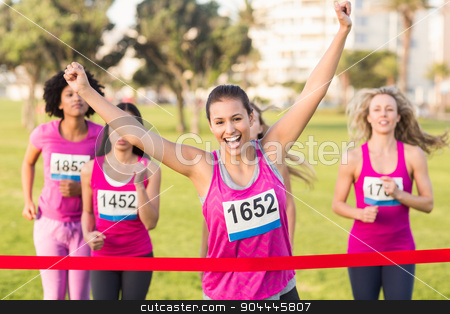 To use this stock image in your creative project, please select the size you need over to the right and click the "Add to Cart" button.
Your downloaded image will come with the Cutcaster watermark removed so don’t worry about the watermark you see on this page. Cheering brunette winning breast cancer marathon stock photo, Portrait of cheering brunette winning breast cancer marathon in parkland by Wavebreak Media