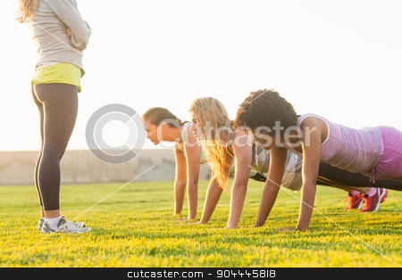 To use this stock image in your creative project, please select the size you need over to the right and click the "Add to Cart" button.
Your downloaded image will come with the Cutcaster watermark removed so don’t worry about the watermark you see on this page. Sporty women doing push ups during fitness class stock photo, Sporty women doing push ups during fitness class in parkland by Wavebreak Media