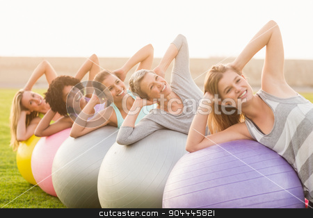 To use this stock image in your creative project, please select the size you need over to the right and click the "Add to Cart" button.
Your downloaded image will come with the Cutcaster watermark removed so don’t worry about the watermark you see on this page. Smiling sporty women working out with exercise balls stock photo, Portrait of smiling sporty women working out with exercise balls in parkland by Wavebreak Media