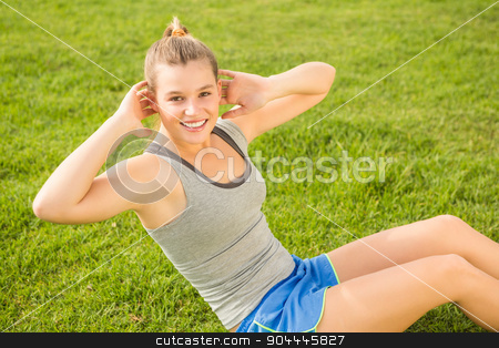 To use this stock image in your creative project, please select the size you need over to the right and click the "Add to Cart" button.
Your downloaded image will come with the Cutcaster watermark removed so don’t worry about the watermark you see on this page. Smiling sporty blonde doing sit ups stock photo, Portrait of smiling sporty blonde doing sit ups in parkland by Wavebreak Media