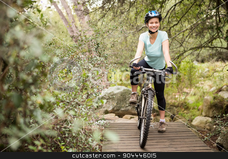To use this stock image in your creative project, please select the size you need over to the right and click the "Add to Cart" button.
Your downloaded image will come with the Cutcaster watermark removed so don’t worry about the watermark you see on this page. Smiling fit woman taking a break on her bike stock photo, Smiling fit woman taking a break on her bike on a wooden path by Wavebreak Media