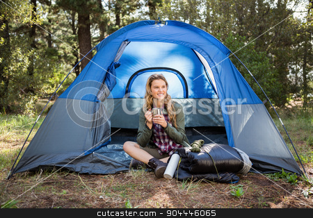 To use this stock image in your creative project, please select the size you need over to the right and click the "Add to Cart" button.
Your downloaded image will come with the Cutcaster watermark removed so don’t worry about the watermark you see on this page. Pretty blonde camper smiling and sitting in tent stock photo, Pretty blonde camper smiling and sitting in tent in the nature by Wavebreak Media