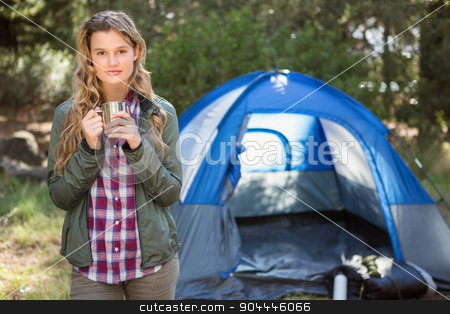 To use this stock image in your creative project, please select the size you need over to the right and click the "Add to Cart" button.
Your downloaded image will come with the Cutcaster watermark removed so don’t worry about the watermark you see on this page. Pretty blonde camper standing in front of tent stock photo, Portrait of pretty blonde camper standing in front of tent in the nature by Wavebreak Media