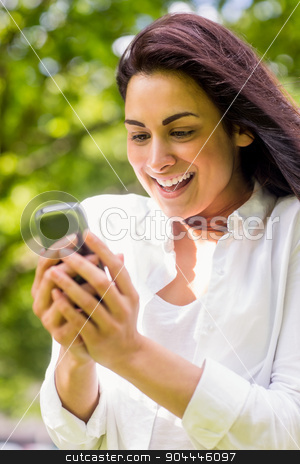 To use this stock image in your creative project, please select the size you need over to the right and click the "Add to Cart" button.
Your downloaded image will come with the Cutcaster watermark removed so don’t worry about the watermark you see on this page. Beautiful brunette in the park sending text stock photo, Beautiful brunette in the park sending text on a sunny day by Wavebreak Media