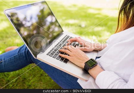 To use this stock image in your creative project, please select the size you need over to the right and click the "Add to Cart" button.
Your downloaded image will come with the Cutcaster watermark removed so don’t worry about the watermark you see on this page. Beautiful brunette using laptop in the park stock photo, Beautiful brunette using laptop in the park on a sunny day by Wavebreak Media