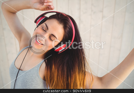 To use this stock image in your creative project, please select the size you need over to the right and click the "Add to Cart" button.
Your downloaded image will come with the Cutcaster watermark removed so don’t worry about the watermark you see on this page. Pretty hipster listening to music stock photo, Pretty hipster listening to music on wooden planks background by Wavebreak Media