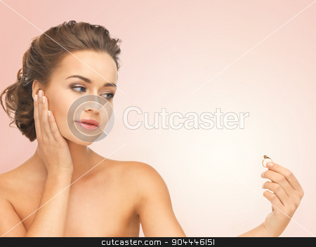 To use this stock image in your creative project, please select the size you need over to the right and click the "Add to Cart" button.
Your downloaded image will come with the Cutcaster watermark removed so don’t worry about the watermark you see on this page. woman with wedding ring stock photo, beautiful woman looking at wedding ring and thinking by Syda Productions
