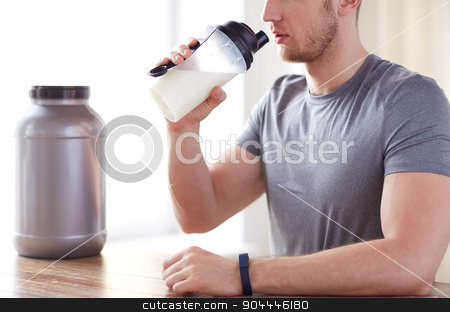 To use this stock image in your creative project, please select the size you need over to the right and click the "Add to Cart" button.
Your downloaded image will come with the Cutcaster watermark removed so don’t worry about the watermark you see on this page. close up of man drinking protein shake stock photo, sport, fitness, healthy lifestyle and people concept - close up of man in fitness bracelet with jar and bottle drinking protein shake by Syda Productions