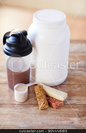 To use this stock image in your creative project, please select the size you need over to the right and click the "Add to Cart" button.
Your downloaded image will come with the Cutcaster watermark removed so don’t worry about the watermark you see on this page. close up of protein food and additives on table stock photo, sport, fitness, diet and food concept - close up of jar, protein shake bottle and muesli bars on wooden table by Syda Productions