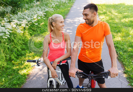 To use this stock image in your creative project, please select the size you need over to the right and click the "Add to Cart" button.
Your downloaded image will come with the Cutcaster watermark removed so don’t worry about the watermark you see on this page. happy couple riding bicycle outdoors stock photo, fitness, sport, people and healthy lifestyle concept - happy couple riding bicycle outdoors at summer by Syda Productions
