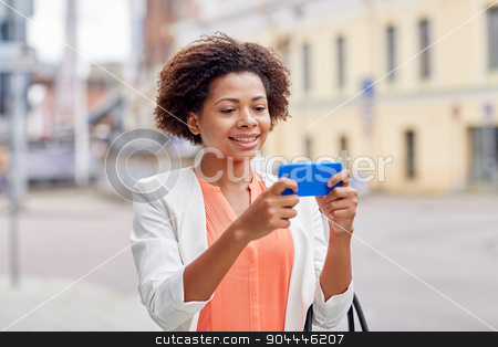 To use this stock image in your creative project, please select the size you need over to the right and click the "Add to Cart" button.
Your downloaded image will come with the Cutcaster watermark removed so don’t worry about the watermark you see on this page. happy african businesswoman with smartphone stock photo, business, technology, communication and people concept - young smiling african american businesswoman with smartphone reading message on city street by Syda Productions