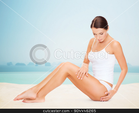 To use this stock image in your creative project, please select the size you need over to the right and click the "Add to Cart" button.
Your downloaded image will come with the Cutcaster watermark removed so don’t worry about the watermark you see on this page. beautiful woman touching her hips stock photo, people, beauty, spa and resort concept - beautiful woman in cotton underwear touching her hips over infinity edge pool background by Syda Productions