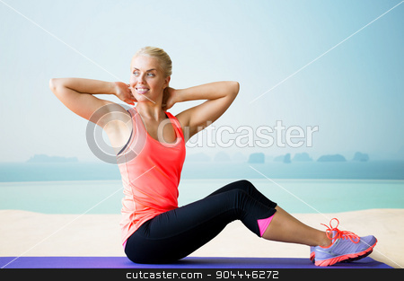 To use this stock image in your creative project, please select the size you need over to the right and click the "Add to Cart" button.
Your downloaded image will come with the Cutcaster watermark removed so don’t worry about the watermark you see on this page. smiling woman doing sit-up on mat over pool stock photo, fitness, sport, exercising and people concept - smiling woman doing sit-up on mat over sea and pool at hotel resort background by Syda Productions