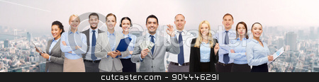 To use this stock image in your creative project, please select the size you need over to the right and click the "Add to Cart" button.
Your downloaded image will come with the Cutcaster watermark removed so don’t worry about the watermark you see on this page. group of happy businesspeople with dollar money stock photo, business, people, finances and banking concept - group of happy businesspeople with money bags over city background by Syda Productions