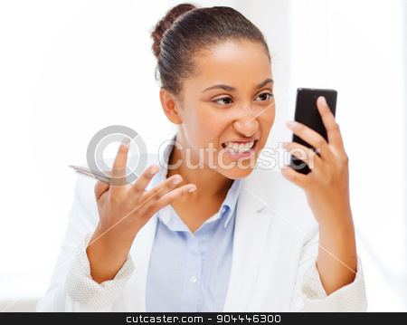 To use this stock image in your creative project, please select the size you need over to the right and click the "Add to Cart" button.
Your downloaded image will come with the Cutcaster watermark removed so don’t worry about the watermark you see on this page. african woman shouting into smartphone stock photo, business, and communication concept - african woman shouting into smartphone by Syda Productions