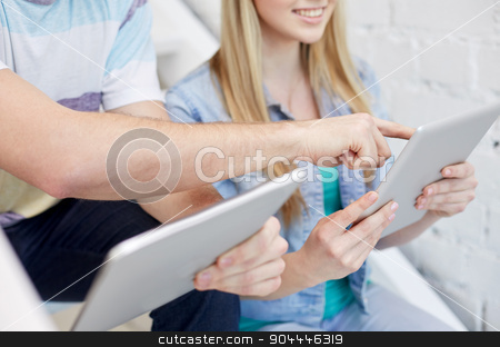 To use this stock image in your creative project, please select the size you need over to the right and click the "Add to Cart" button.
Your downloaded image will come with the Cutcaster watermark removed so don’t worry about the watermark you see on this page. close up of students with tablet pc at school stock photo, education, technology, people and internet concept - close up of smiling students with tablet pc computers at school by Syda Productions