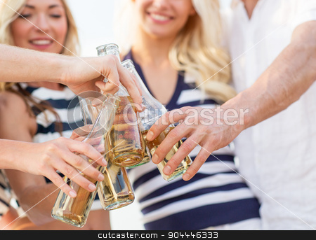 To use this stock image in your creative project, please select the size you need over to the right and click the "Add to Cart" button.
Your downloaded image will come with the Cutcaster watermark removed so don’t worry about the watermark you see on this page. close up of friends clinking bottles with drinks stock photo, vacation, celebration, holidays and people concept - close up of happy friends clinking bottles with drinks at party by Syda Productions