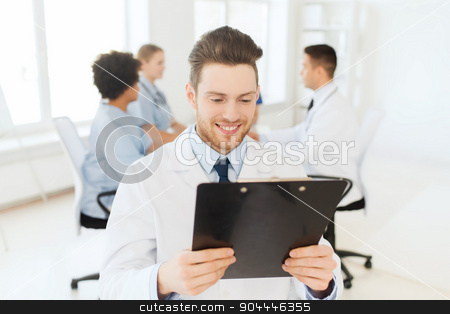 To use this stock image in your creative project, please select the size you need over to the right and click the "Add to Cart" button.
Your downloaded image will come with the Cutcaster watermark removed so don’t worry about the watermark you see on this page. happy doctor with tablet pc over team at clinic stock photo, clinic, profession, people and medicine concept - happy male doctor with tablet pc computer over group of medics meeting at hospital by Syda Productions