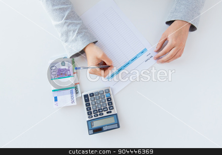 To use this stock image in your creative project, please select the size you need over to the right and click the "Add to Cart" button.
Your downloaded image will come with the Cutcaster watermark removed so don’t worry about the watermark you see on this page. close up of hands counting money with calculator stock photo, business, finance, tax and people concept - close up of woman hands counting euro money with calculator and tax report form by Syda Productions
