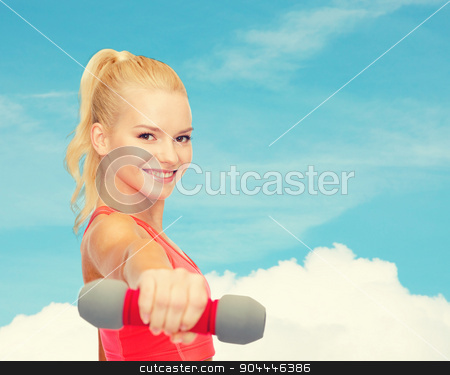 To use this stock image in your creative project, please select the size you need over to the right and click the "Add to Cart" button.
Your downloaded image will come with the Cutcaster watermark removed so don’t worry about the watermark you see on this page. smiling beautiful sporty woman with dumbbell stock photo, fitness, sport and diet concept - smiling beautiful sporty woman with dumbbell by Syda Productions