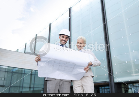 To use this stock image in your creative project, please select the size you need over to the right and click the "Add to Cart" button.
Your downloaded image will come with the Cutcaster watermark removed so don’t worry about the watermark you see on this page. smiling businessmen with blueprint and helmets stock photo, business, partnership, architecture and people concept - smiling businessman and businesswoman with blueprint and helmets on city street by Syda Productions