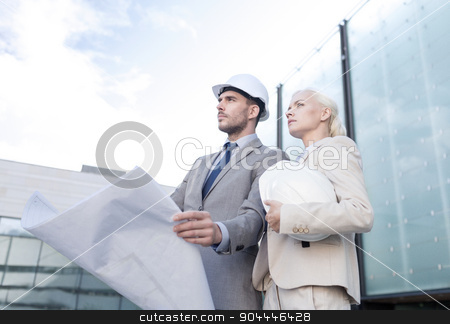 To use this stock image in your creative project, please select the size you need over to the right and click the "Add to Cart" button.
Your downloaded image will come with the Cutcaster watermark removed so don’t worry about the watermark you see on this page. businessmen with blueprint and helmets stock photo, business, partnership, architecture and people concept - businessman and businesswoman with blueprint and helmets on city street by Syda Productions