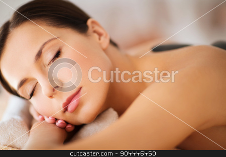 To use this stock image in your creative project, please select the size you need over to the right and click the "Add to Cart" button.
Your downloaded image will come with the Cutcaster watermark removed so don’t worry about the watermark you see on this page. beautiful woman in spa salon with hot stones stock photo, health and beauty, resort and relaxation concept - beautiful woman with closed eyes in spa salon with hot stones by Syda Productions