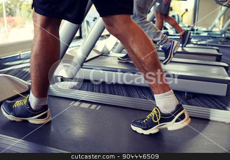 To use this stock image in your creative project, please select the size you need over to the right and click the "Add to Cart" button.
Your downloaded image will come with the Cutcaster watermark removed so don’t worry about the watermark you see on this page. close up of men legs walking on treadmills in gym stock photo, sport, fitness, lifestyle, technology and people concept - close up of men legs walking on treadmills in gym by Syda Productions