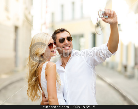 To use this stock image in your creative project, please select the size you need over to the right and click the "Add to Cart" button.
Your downloaded image will come with the Cutcaster watermark removed so don’t worry about the watermark you see on this page. travelling couple taking photo picture with camera stock photo, summer holidays, travel, vacation, tourism and dating concept - travelling couple taking photo picture with camera by Syda Productions