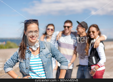 To use this stock image in your creative project, please select the size you need over to the right and click the "Add to Cart" button.
Your downloaded image will come with the Cutcaster watermark removed so don’t worry about the watermark you see on this page. teenage girl with headphones and friends outside stock photo, summer holidays and teenage concept - teenage girl in sunglasses and headphones hanging out with friends outside by Syda Productions