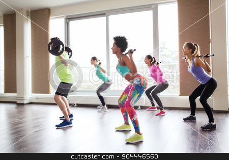 To use this stock image in your creative project, please select the size you need over to the right and click the "Add to Cart" button.
Your downloaded image will come with the Cutcaster watermark removed so don’t worry about the watermark you see on this page. group of people exercising with barbell in gym stock photo, fitness, sport, training, gym and lifestyle concept - group of people exercising with barbell and bars in gym by Syda Productions