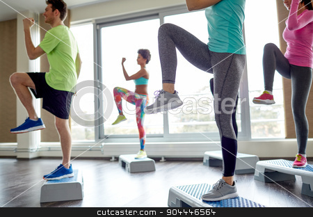 To use this stock image in your creative project, please select the size you need over to the right and click the "Add to Cart" button.
Your downloaded image will come with the Cutcaster watermark removed so don’t worry about the watermark you see on this page. group of people raising legs on step platforms stock photo, fitness, sport, aerobics and people concept - group of smiling people working out and raising legs on step platforms in gym by Syda Productions