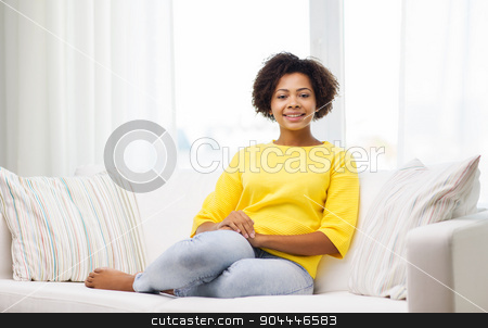 To use this stock image in your creative project, please select the size you need over to the right and click the "Add to Cart" button.
Your downloaded image will come with the Cutcaster watermark removed so don’t worry about the watermark you see on this page. happy african american young woman at home stock photo, people, race, ethnicity and leisure concept - happy african american young woman sitting on sofa at home by Syda Productions