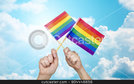 To use this stock image in your creative project, please select the size you need over to the right and click the "Add to Cart" button.
Your downloaded image will come with the Cutcaster watermark removed so don’t worry about the watermark you see on this page. hands holding rainbow flags over sky background stock photo, people, gay pride and homosexual concept - human hands holding rainbow flags over blue sky background by Syda Productions