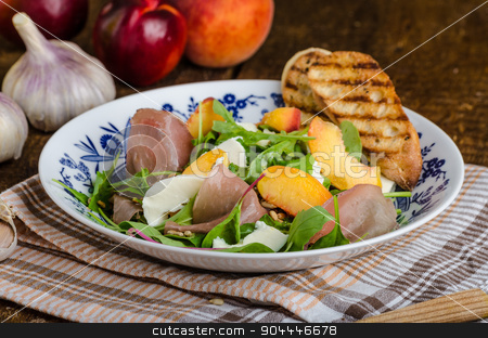 To use this stock image in your creative project, please select the size you need over to the right and click the "Add to Cart" button.
Your downloaded image will come with the Cutcaster watermark removed so don’t worry about the watermark you see on this page. Rocket salad with prosciutto and fruit stock photo, Rocket salad with prosciutto, mozzarella and peaches, panini baguette with bio garlic by Peteer