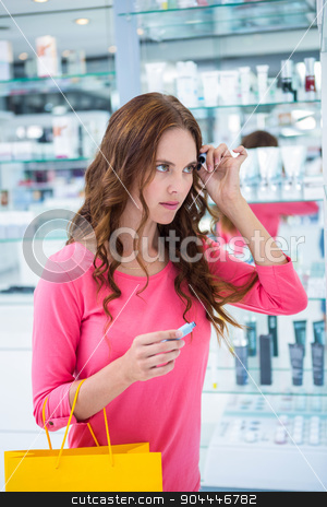 To use this stock image in your creative project, please select the size you need over to the right and click the "Add to Cart" button.
Your downloaded image will come with the Cutcaster watermark removed so don’t worry about the watermark you see on this page. Pretty woman trying a mascara stock photo, Pretty woman trying a mascara at the pharmacy by Wavebreak Media