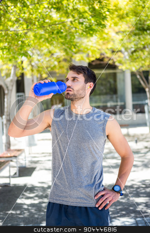 To use this stock image in your creative project, please select the size you need over to the right and click the "Add to Cart" button.
Your downloaded image will come with the Cutcaster watermark removed so don’t worry about the watermark you see on this page. Handsome runner drinking water with hands on hips stock photo, Handsome runner drinking water with hands on hips on a sunny day by Wavebreak Media