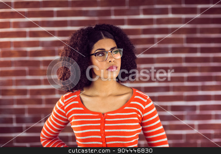 To use this stock image in your creative project, please select the size you need over to the right and click the "Add to Cart" button.
Your downloaded image will come with the Cutcaster watermark removed so don’t worry about the watermark you see on this page. Concentrated attractive young woman stock photo, Concentrated attractive young woman against red brick background by Wavebreak Media