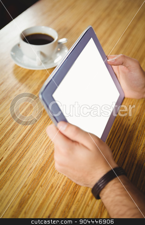 To use this stock image in your creative project, please select the size you need over to the right and click the "Add to Cart" button.
Your downloaded image will come with the Cutcaster watermark removed so don’t worry about the watermark you see on this page. Young man having cup of coffee using tablet stock photo, Young man having cup of coffee using tablet at the cafe by Wavebreak Media
