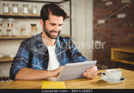 To use this stock image in your creative project, please select the size you need over to the right and click the "Add to Cart" button.
Your downloaded image will come with the Cutcaster watermark removed so don’t worry about the watermark you see on this page. Young man having cup of coffee using tablet stock photo, Young man having cup of coffee using tablet at the cafe by Wavebreak Media