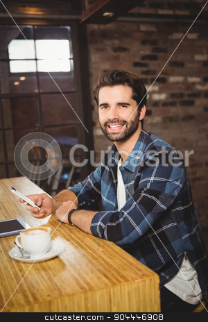To use this stock image in your creative project, please select the size you need over to the right and click the "Add to Cart" button.
Your downloaded image will come with the Cutcaster watermark removed so don’t worry about the watermark you see on this page. Young student using his smartphone stock photo, Young student using his smartphone in cafe by Wavebreak Media