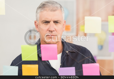 To use this stock image in your creative project, please select the size you need over to the right and click the "Add to Cart" button.
Your downloaded image will come with the Cutcaster watermark removed so don’t worry about the watermark you see on this page. Casual businessman looking at a post it wall stock photo, Casual businessman looking at a post it wall at office by Wavebreak Media
