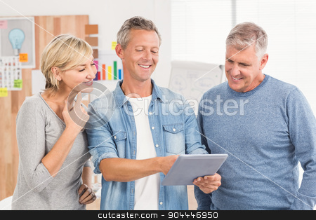 To use this stock image in your creative project, please select the size you need over to the right and click the "Add to Cart" button.
Your downloaded image will come with the Cutcaster watermark removed so don’t worry about the watermark you see on this page. Smiling business colleagues working on a tablet stock photo, Smiling business colleagues working on a tablet at the office by Wavebreak Media