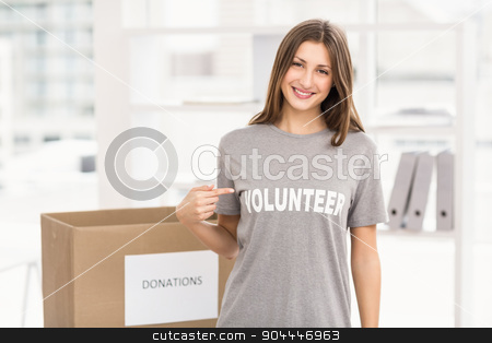 To use this stock image in your creative project, please select the size you need over to the right and click the "Add to Cart" button.
Your downloaded image will come with the Cutcaster watermark removed so don’t worry about the watermark you see on this page. Smiling brunette volunteer showing her shirt stock photo, Portrait of smiling brunette volunteer showing her shirt in the office by Wavebreak Media