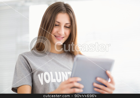To use this stock image in your creative project, please select the size you need over to the right and click the "Add to Cart" button.
Your downloaded image will come with the Cutcaster watermark removed so don’t worry about the watermark you see on this page. Smiling brunette volunteer using tablet stock photo, Smiling brunette volunteer using tablet in the office by Wavebreak Media