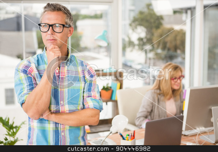 To use this stock image in your creative project, please select the size you need over to the right and click the "Add to Cart" button.
Your downloaded image will come with the Cutcaster watermark removed so don’t worry about the watermark you see on this page. Thoughtful casual designer in front of his working colleague stock photo, Thoughtful casual designer in front of his working colleague in the office by Wavebreak Media