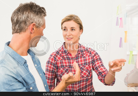 To use this stock image in your creative project, please select the size you need over to the right and click the "Add to Cart" button.
Your downloaded image will come with the Cutcaster watermark removed so don’t worry about the watermark you see on this page. Casual business colleagues working with sticky notes stock photo, Casual business colleagues working with sticky notes in the office by Wavebreak Media